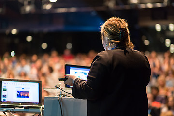 Image showing Female public speaker giving talk at Business Event.