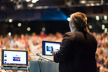Image showing Female public speaker giving talk at Business Event.