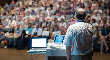 Image showing Public speaker giving talk at Business Event.