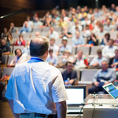 Image showing Public speaker giving talk at Business Event.