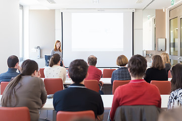 Image showing Woman giving presentation in lecture hall at university.