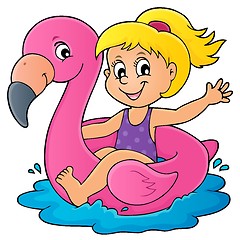 Image showing Girl floating on inflatable flamingo 1