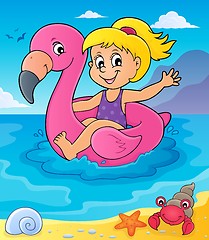 Image showing Girl floating on inflatable flamingo 4