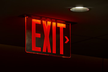 Image showing a red lit exit sign