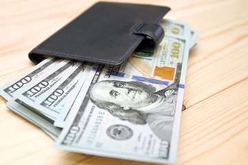 Image showing Heap of money and wallet