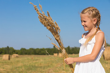 Image showing Happy little girl playing in the park at the day time.