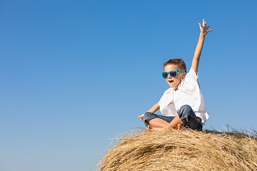 Image showing Happy little boy playing in the park at the day time.