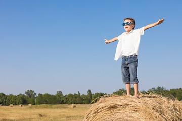 Image showing Happy little boy playing in the park at the day time.