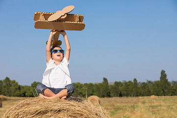 Image showing Happy little boy playing in the park at the day time.