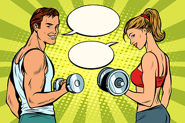 Image showing Man and woman in the gym with dumbbells