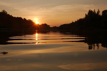 Image showing Sunset over a river