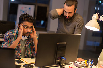 Image showing creative team with computer working late at office