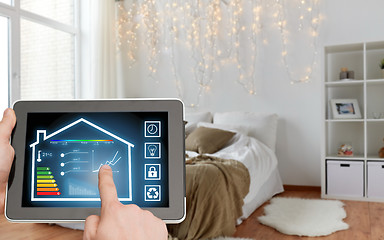 Image showing tablet pc with smart home settings on screen