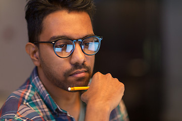 Image showing close up of creative man working at night office