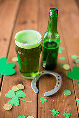 Image showing glass of green beer, horseshoe and gold coins