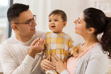 Image showing happy family with baby daughter at home