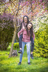 Image showing Two sisters having fun in the park