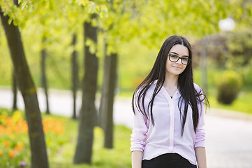 Image showing Teenager girl looking at camera and smiling