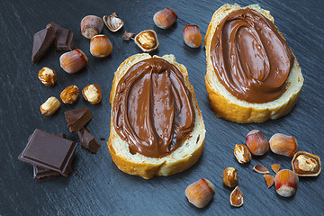 Image showing Two bread slices with chocolate hazelnut spread