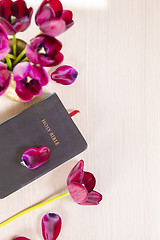 Image showing Holy Bible and flowers on wood table