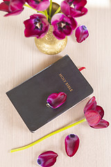 Image showing Holy Bible with flowers on wooden table