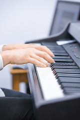 Image showing Pianist is playing a song at the church