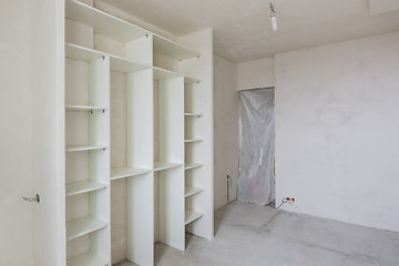 Image showing Repair in the living room of a new building, built-in wardrobe and closed by a cloth entrance to the room