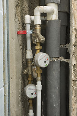 Image showing Not sealed hot and cold water meters in a new building