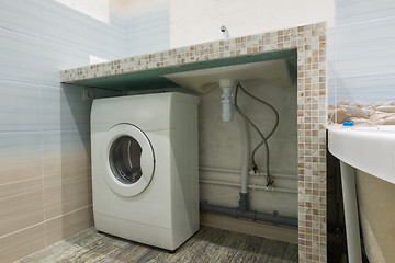 Image showing Homemade pedestal in the washbasin in the bathroom, space for a washing machine