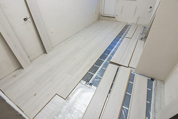 Image showing Laying laminate with warm floor film