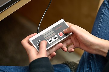 Image showing Nintengo NES,playing Super Mario 3