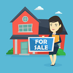 Image showing Young female realtor offering house.