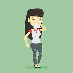 Image showing Young asian sick woman sneezing.