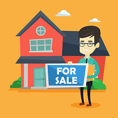 Image showing Young asian realtor offering house.