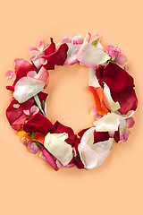 Image showing Letter O made from red roses and petals isolated on a white background