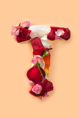 Image showing Letter T made from red roses and petals isolated on a white background