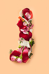 Image showing Letter J made from red roses and petals isolated on a white background