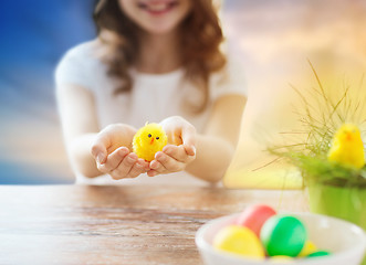 Image showing close up of girl holding easter toy chicken