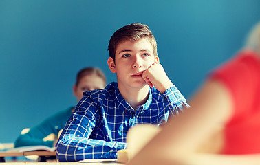 Image showing group of students with notebooks at school lesson