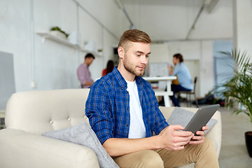 Image showing man with tablet pc working at office