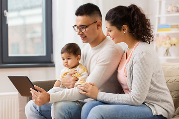 Image showing mother, father and baby with tablet pc at home