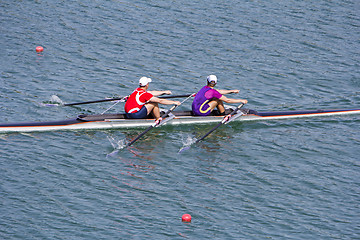 Image showing Two young rowers in a racing rower boat