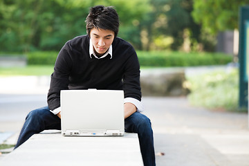 Image showing Asian student with laptop