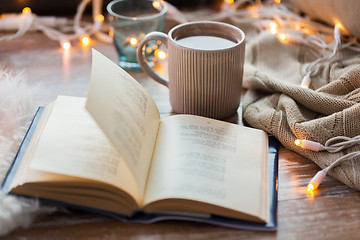 Image showing book and cup of coffee or hot chocolate on table