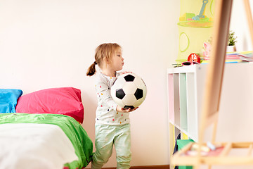 Image showing happy little girl with socker ball at home