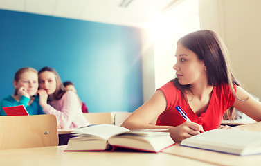 Image showing students gossiping behind classmate back at school