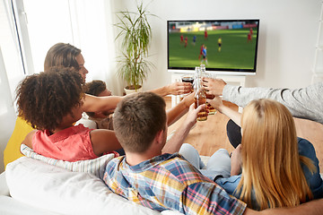 Image showing friends clinking beer and watching soccer game