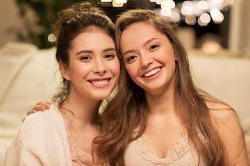 Image showing happy female friends hugging