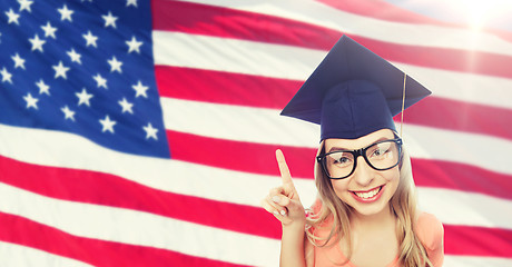 Image showing smiling young student woman in mortarboard