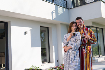 Image showing Young beautiful couple in bathrobes